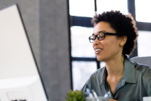 woman analyzing data at computer